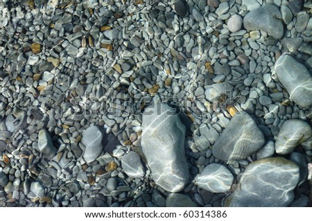 beautiful pebbles with flashing light  are a picturesque background