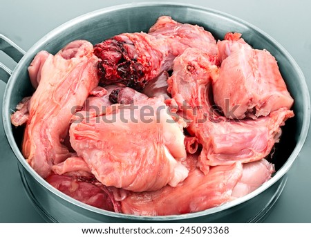pieces of rabbit meat in a skillet