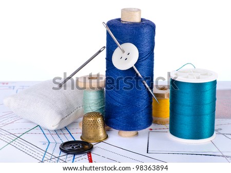 Collection of sewing tools and supplies in a sewing kit on  sewing plan. The image collected from five shots to increase the zone of focus