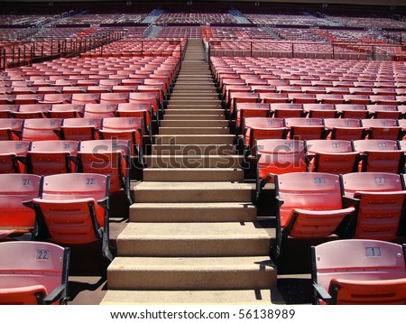 Rows of empty orange stadium seats going upward. Candlestick stadium San Francisco