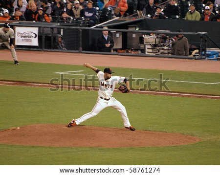 SAN FRANCISCO - MAY 11: Giants Vs. Padres: Giants pitcher Sergio Romo steps forward to throw a pitch in relief during a night game.  Taken May 11 2010 at Att Park San Francisco California