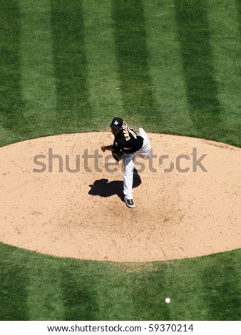 OAKLAND, CA - AUGUST 18: Blue Jays vs. Athletics: Athletics Gio Gonzalez steps forward as he throws a pitch.  Taken on August 18 2010 at Coliseum in Oakland California.