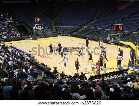 OAKLAND, CA - OCTOBER 6: Golden State Warriors player holds ball behind 3-point line looking for someone to pass to during Open Practice at the Oracle Arena taken October 6, 2010 Oakland California.