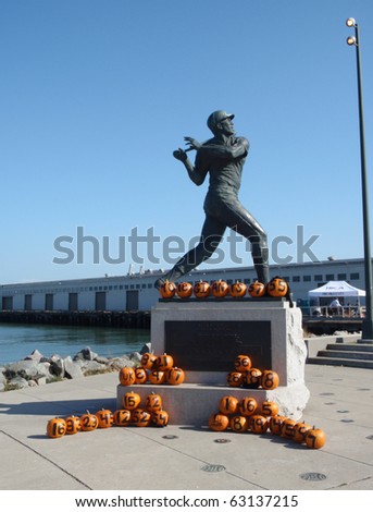 SAN FRANCISCO - OCTOBER 7: Willie McCovey Statue with Pumpkins with black writing cheering on the 2010 San Francisco Giants taken October 7 2010 San Francisco.