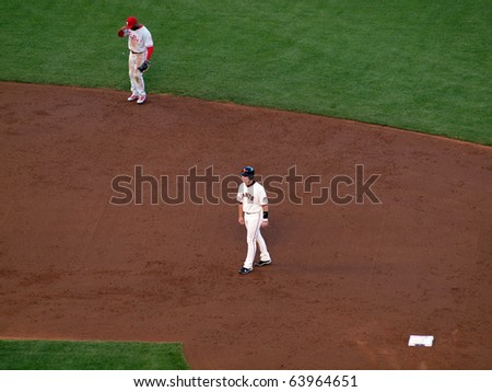 SAN FRANCISCO, CA - OCTOBER 20: Giants vs. Phillies: Buster Posey takes lead from second with Jimmy Rollins standing at shortstop game four of the NLCS 2010 October 20, 2010 AT&T Park San Francisco.