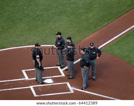 SAN FRANCISCO, CA - OCTOBER 20: The Head Umpire talks to five other umpires at homeplate before start of game 4 of the 2010 NLCS game between San Francisco Giants and Philadelphia Phillies on Oct. 20, 2010 in AT&T Park, San Francisco, CA.