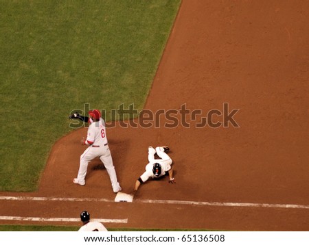 SAN FRANCISCO, CA - OCTOBER 20: Runner Andres Torres slides  back into base as Ryan Howard catches ball plays game 4 2010 NLCS game between Giants and Phillies Oct. 20, 2010 AT&T Park San Francisco.