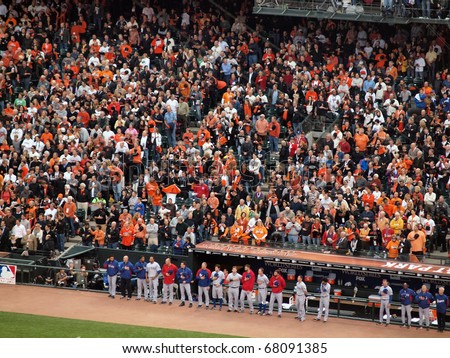 SAN FRANCISCO, CA - OCTOBER 28: Players stand with hats removed in front of the dugout during national anthem game 2 2010 World Series Giants and Rangers Oct. 28, 2010 AT&T Park San Francisco.