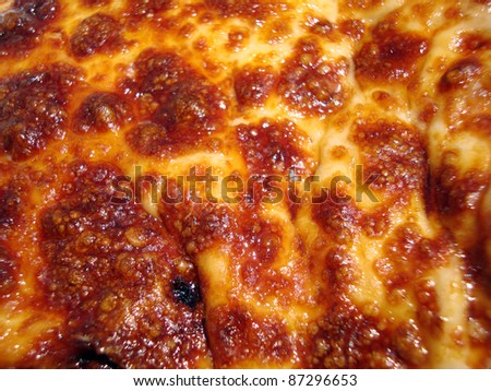 Close-up of melted cheese on top of a cheese pizza, Macro.