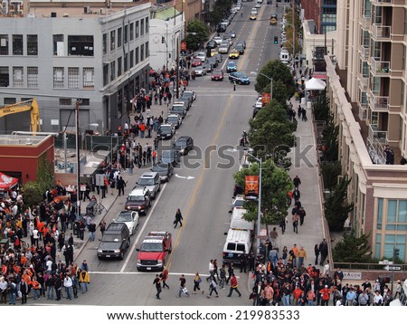SAN FRANCISCO, CA - OCTOBER 28: Aerial view of crowd of people walk along sidewalk towards 2010 World Series game on Second Street with cars Oct. 28, 2010 AT&T Park San Francisco, CA.