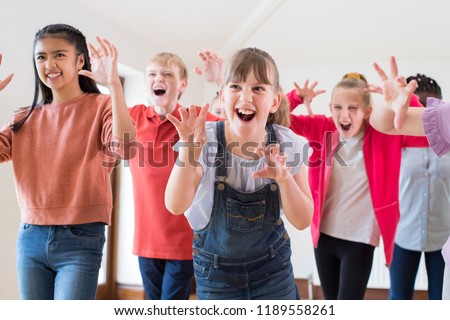 Group Of Children Enjoying Drama Class Together