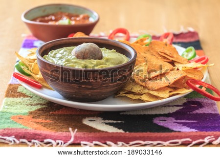Nachos with avocado guacamole, hot pepper and salsa