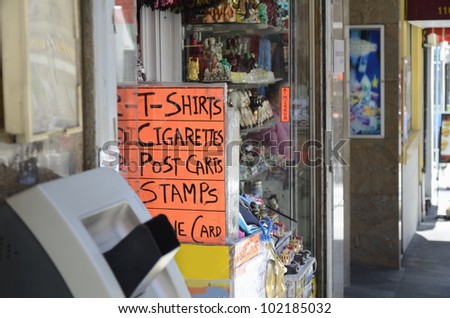 A souvenir shop withe handwritten signs highlighting some of the things on offer inside