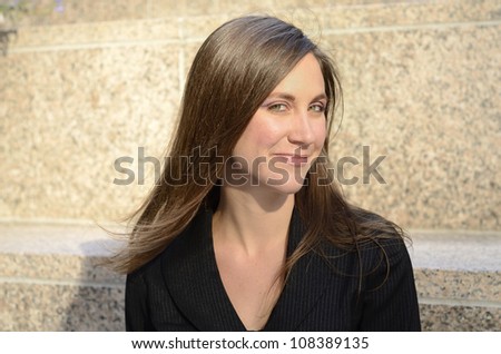 Head and shoulders shot of a young Caucasian woman