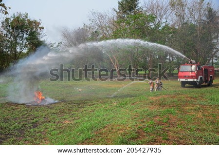 PHITSANULOK Army Camp, THAILAND - April 25, 2014. Two Firemen practice to extinguishing the fire on April 25, 2014. Phitsanulok is the hub of all commercial activity in Northern of Thailand.