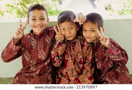 Yala, THAILAND - August 28, 2014. Three unidentified kids Muslim is smile and friendly in city Yala on August 28, 2014.Yala is the south of Thailand.