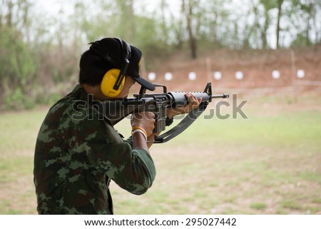 PHITSANULOK Army Camp, THAILAND  - Unidentified that young soldier shooting the rifle.on July 9, 2015 in Phitsanulok. Phitsanulok is the hub of all commercial activity in Northern of Thailand.