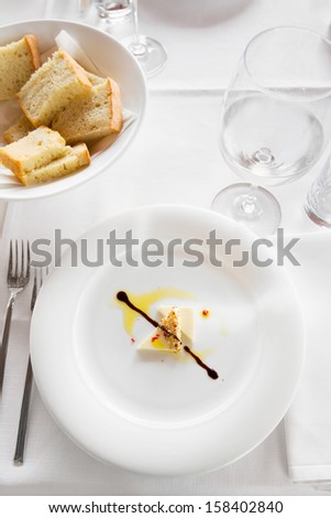 Food in the restaurant/Cheese in soy sauce. Exclusive decorative meal in fancy restaurant.