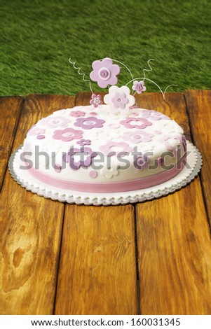 Fondant flower cake/Flower themed cake on picnic table