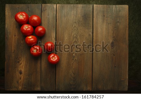 Tomatoes on picnic table/Fresh tomatoes at a picnic table background.