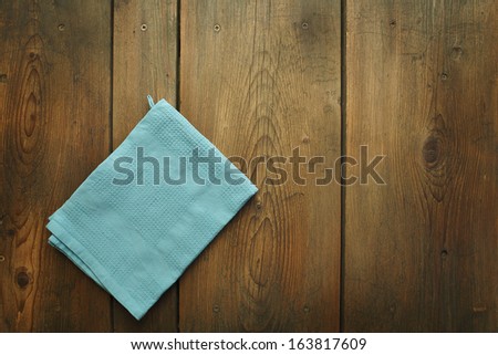 Kitchen Table/Cookbook Background. An Old Wooden Kitchen Table With Kitchen Dish Cloth.