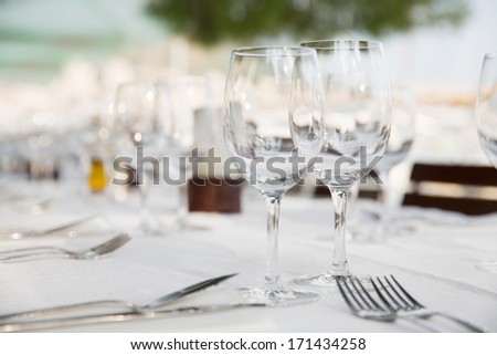 Restaurant/Serving table in restaurant with wine glasses and serving equipment