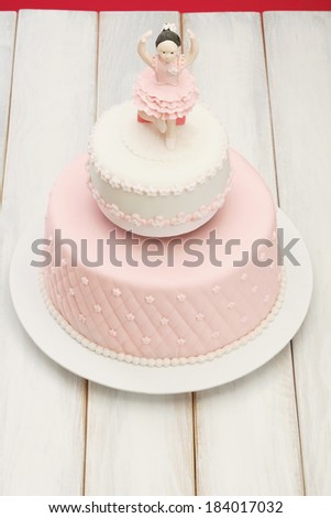 Cake/Decorative fondant pink cake on picnic table. Ballerina cake.
