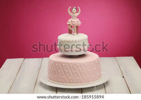 Cake/Decorative fondant pink cake on picnic table.Ballerina cake
