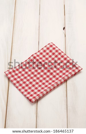 Plaid cloth on picnic table/Picnic table background