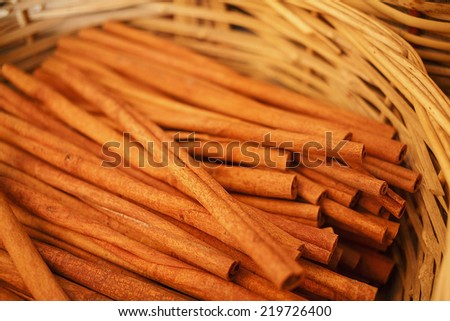 Cinnamon sticks in basket.Very shallow depth of field for soft background/Cinnamon spice