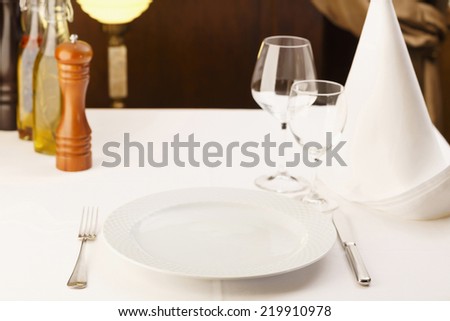 Fine dining restaurant. Dinner table place setting/Restaurant serving table