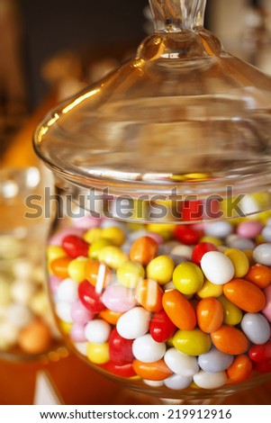 Sweet candy balls in glass jar. Candy shop. Very shallow depth of field for soft background/Sweet candy skittles.