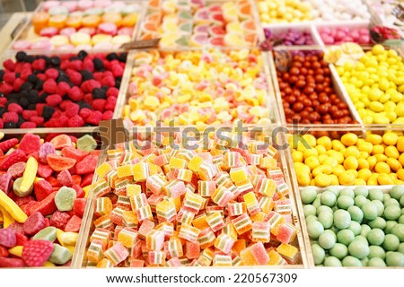 Various jelly candies in candy shop. Sweet food arranged on market