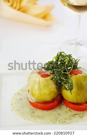 Shelled stuffed zucchini. Stuffed vegetable. Restaurant cuisine. Vegetarian food/Stuffed zucchini
