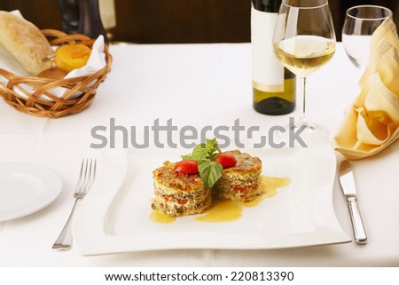 Delicious meat pie served in elegant restaurant. Traditional food. Very shallow depth of field for soft background/Restaurant meal