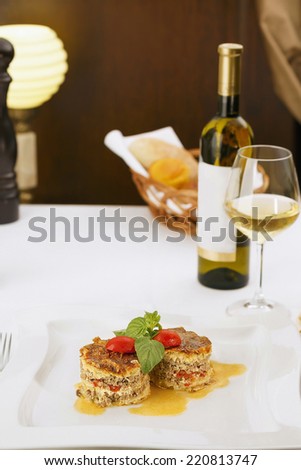 Delicious meat pie served in elegant restaurant. Traditional food. Very shallow depth of field for soft background/Restaurant meal