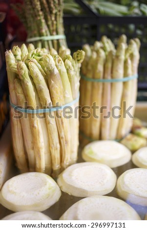 Fresh organic peeled vegetables in water/Peeled asparagus and celery roote