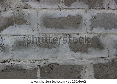Photo texture wall built of gray concrete blocks