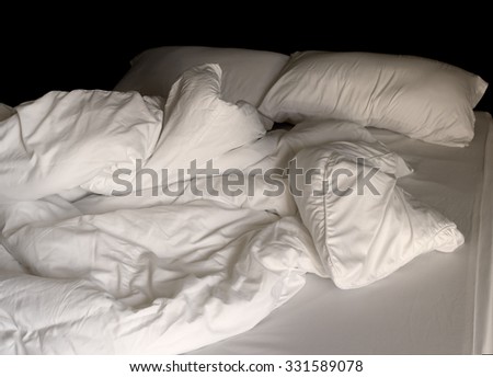 Messy bedding sheets and pillow