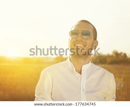 Enjoyment / Focus On Face Of Young Man In The Photo Shop Added The Sun And The Color Of The Background.