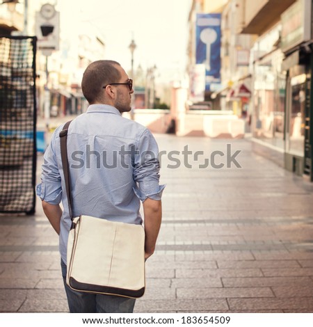 Young man walking the street