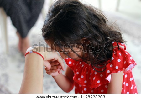 Little kid kissing hand. Little girl kissing hand on religious holiday (sacrifice feast, Ramadan Feast)(Ramazan bayrami, kurban bayrami)