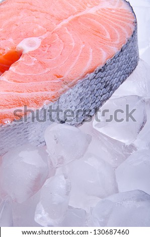One slice of fish on ice, red fish - salmon
