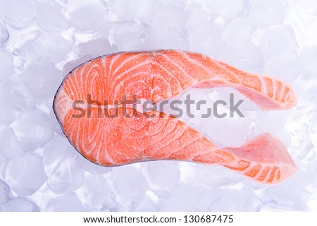 One slice of fish on ice, red fish - salmon