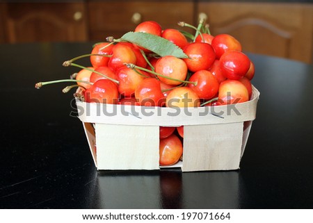 Cherry. Yellow and red cherry. Cherry in a basket.