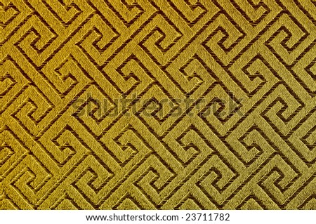 Threaded Asian maze infinite pattern on golden silk