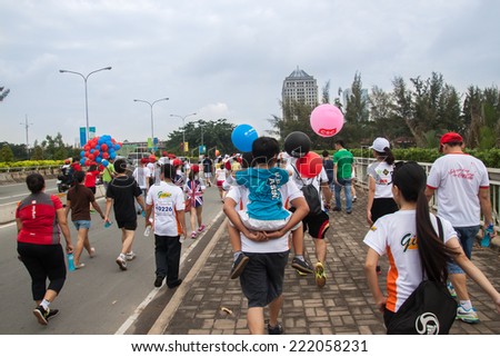 Ho Chi Minh City, Vietnam - September 27 2014: Volunteers of Fun Run program. Fun Run is a charity program to collect money for poverty
