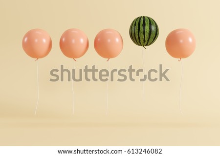 Outstanding balloon watermelon in air concept on pastel yellow background for copy space. minimal concept.