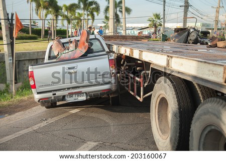 AYUTTHAYA, THAILAND - JULY 06: Rescue forces in a deadly car accident scene on July 06 2014. Road accident coupe gray hit the SUV car on the freeway in rush hour.