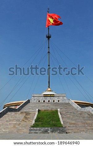 QUANG TRI, VIETNAM - SEPT 13, 2009: Vietnamese flag flying on flag-tower on the side of Ben Hai river. This historical river was the border line between north and south Vietnam in the war before 1975.